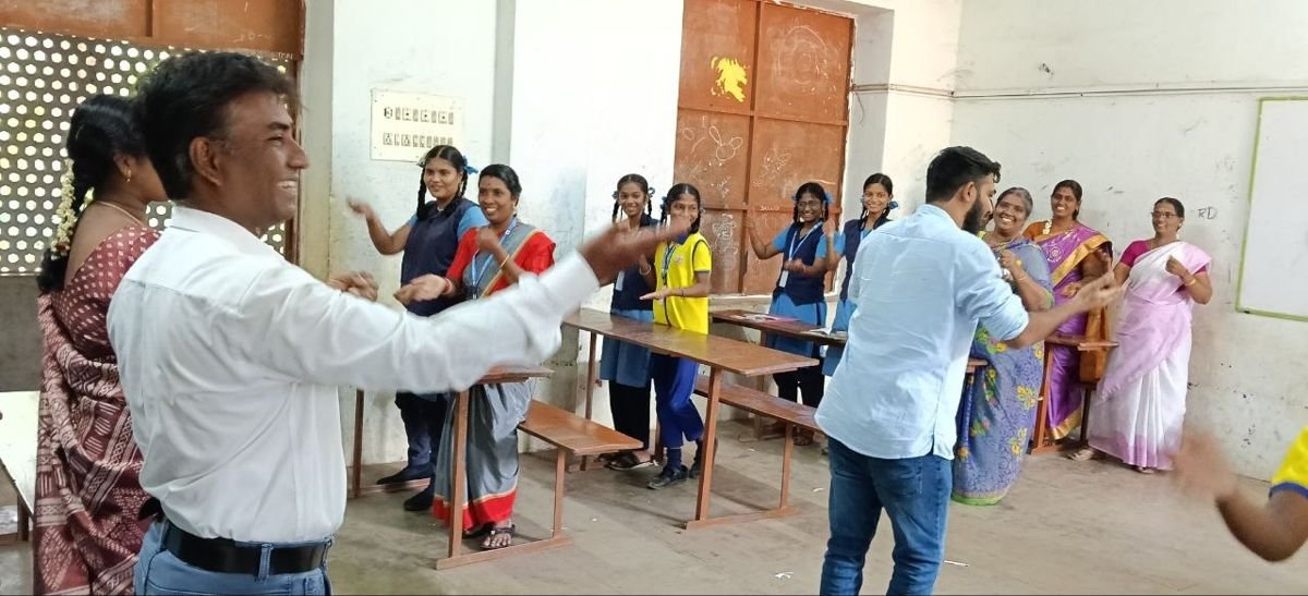 Students and teachers in an activity during a school workshop